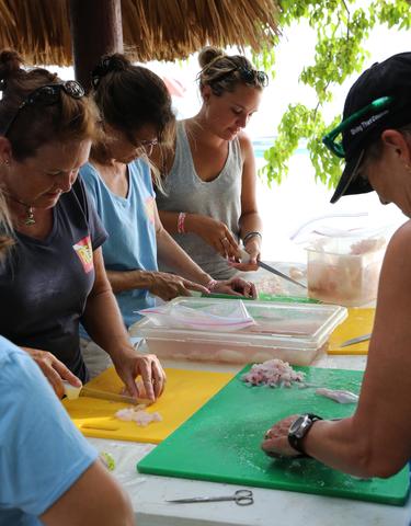 Trip participants spent hours dicing hundreds of fillets for the ceviche dinner. It is important to cut the fillet into small pieces so the lime juice can permeate the meat, curing it thoroughly. (Photo credit Jaclyn Gerakios)