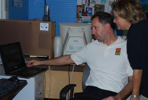 Joseph Cavanaugh demonstrates the new REEF website to the Congresswoman.